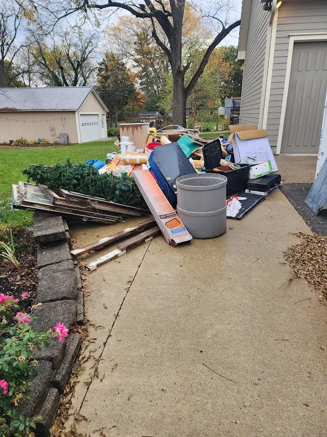 Dumpster being loaded with debris for Roofing Dumpster Rental in Centralia